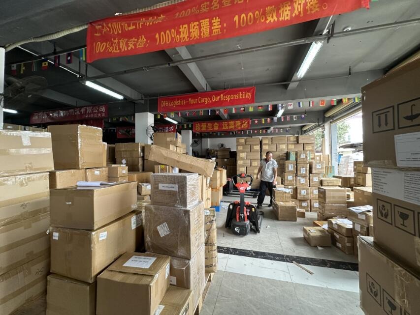 Cartons being checked, repacked and labelled inside the DFH warehouse